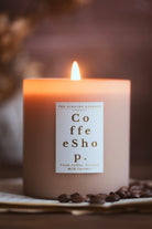 coffee scented candle in a beige taupe jar with gold label
