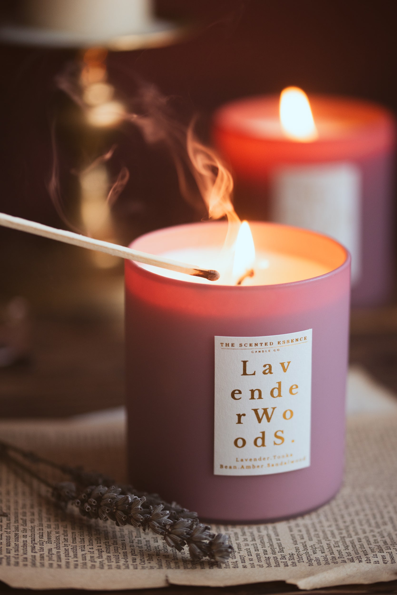Lavender and sandalwood scented candle in purple jar with gold textured label
