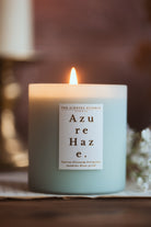 fresh linen laundry scented candle in a powder blue glass jar