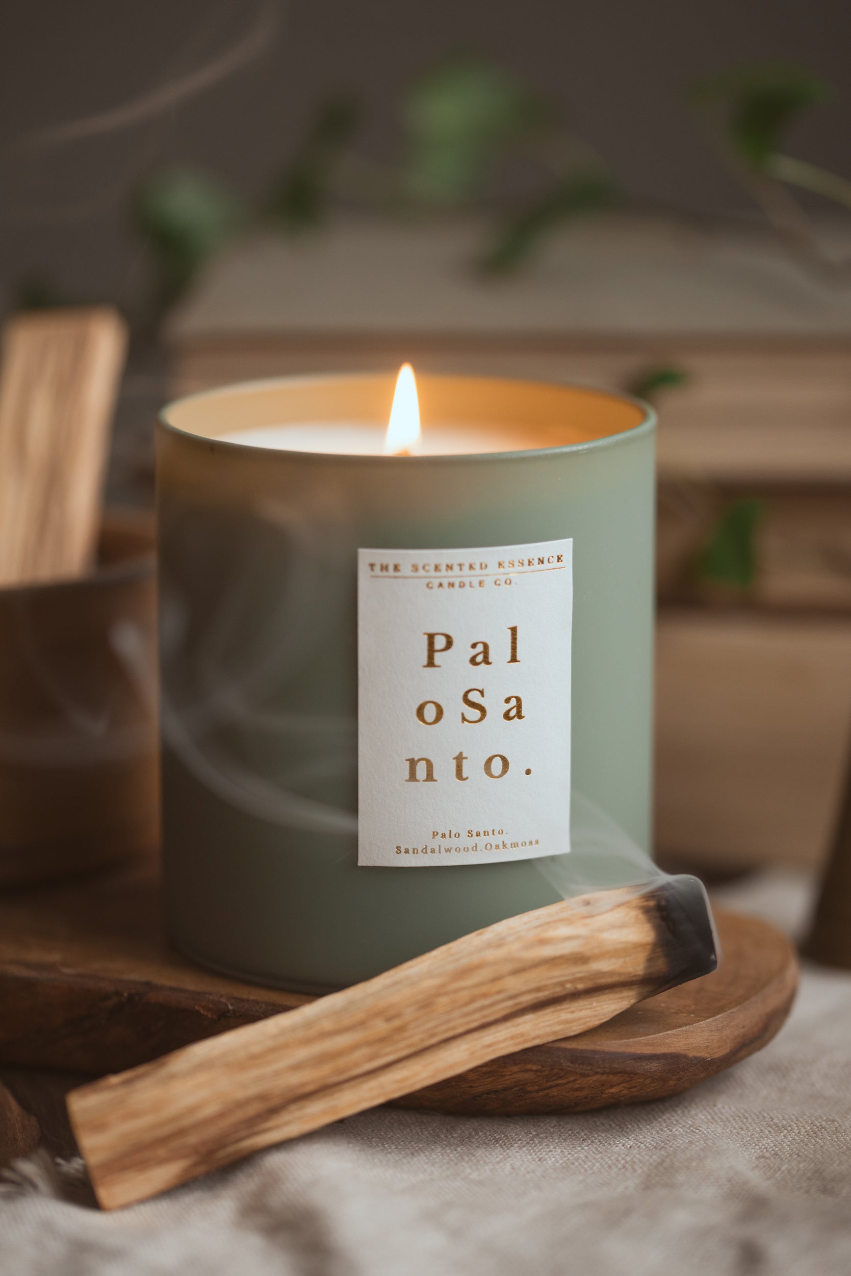 palo santo scented soy candle UK in green jar with gold lid